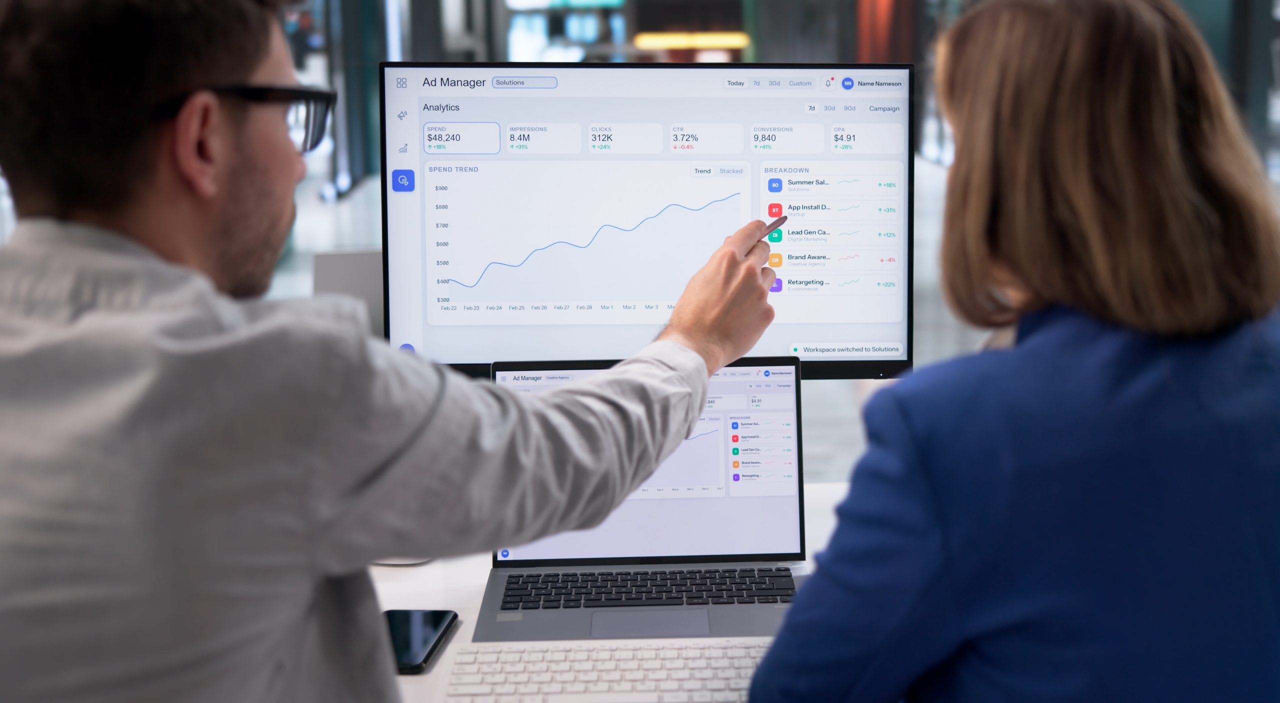 Digital Marketing Specialist Reviews Online Advertising Campaign Metrics On Laptop